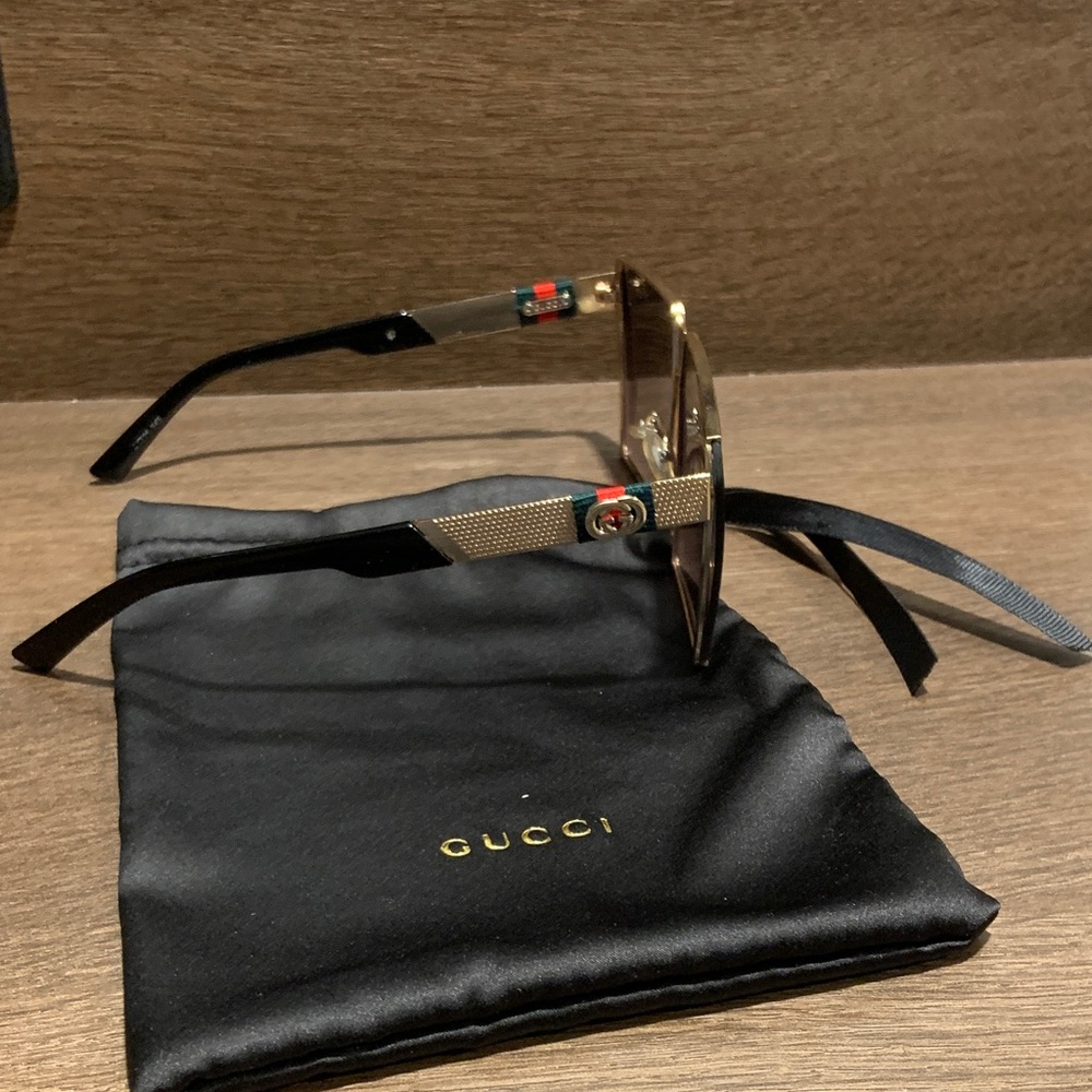 Gucci Women's Sunglasses in Black and Gold - Picture 2 of 3